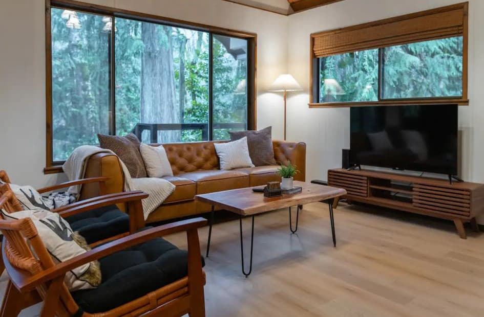 Newly installed flooring in a living room underneath a loft