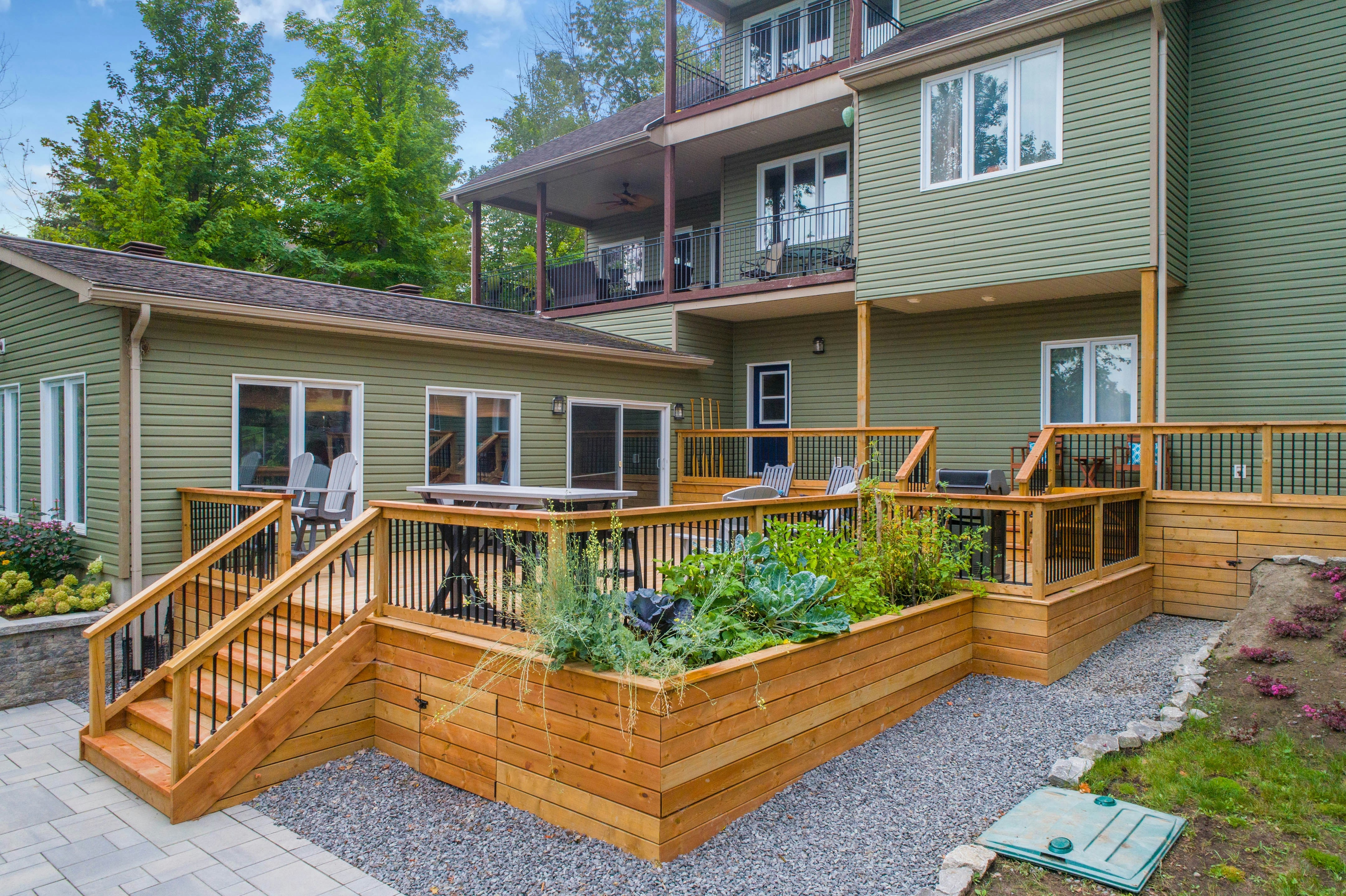 A new small wraparound deck installed at the back of a house